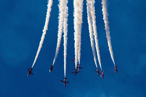 hurn low angle photography of plane contrail united kingdom